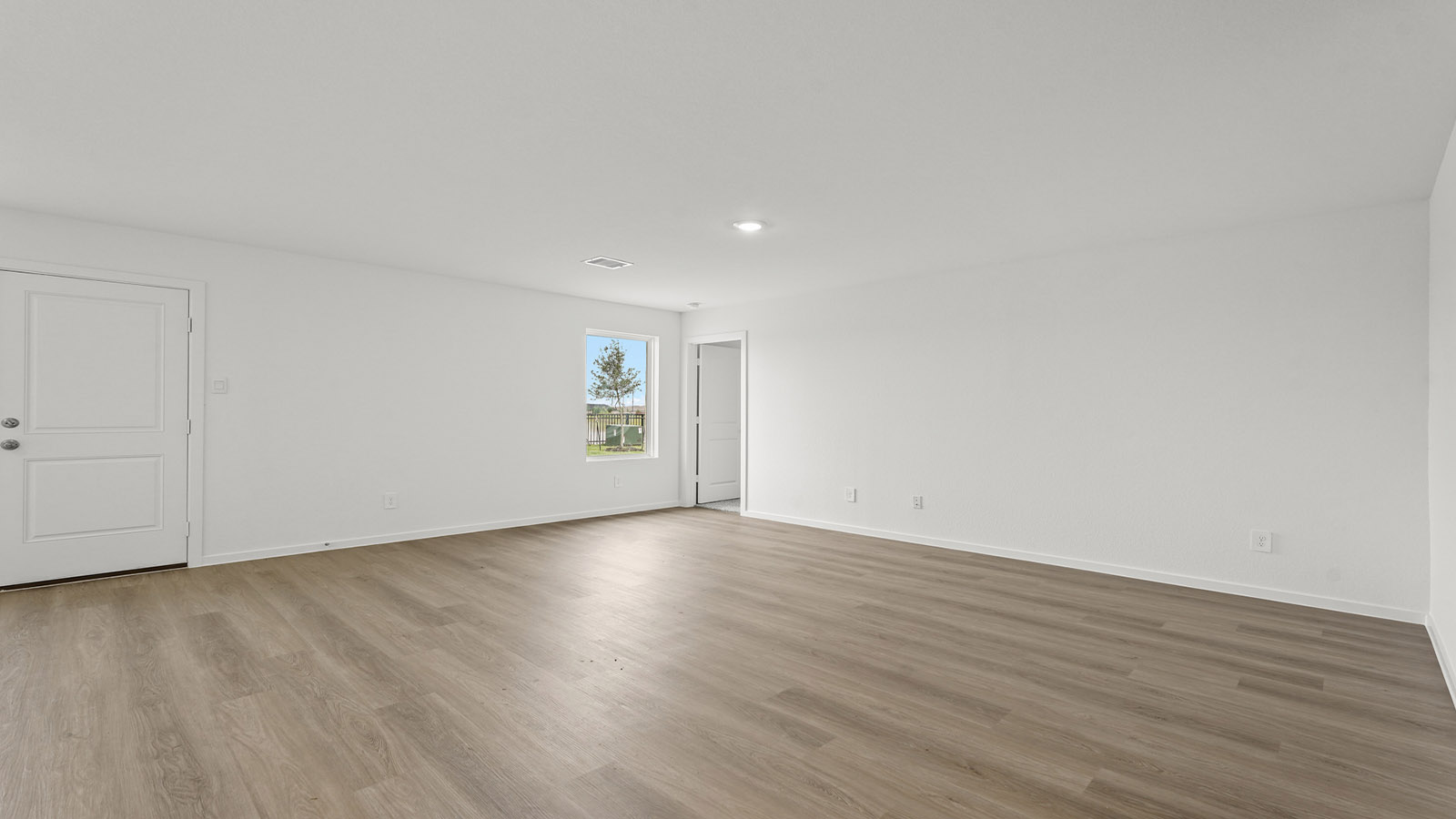 open concept living and dining area with vinylflooring, quartz countertops, and large windows 3028 Nori Shores Drive