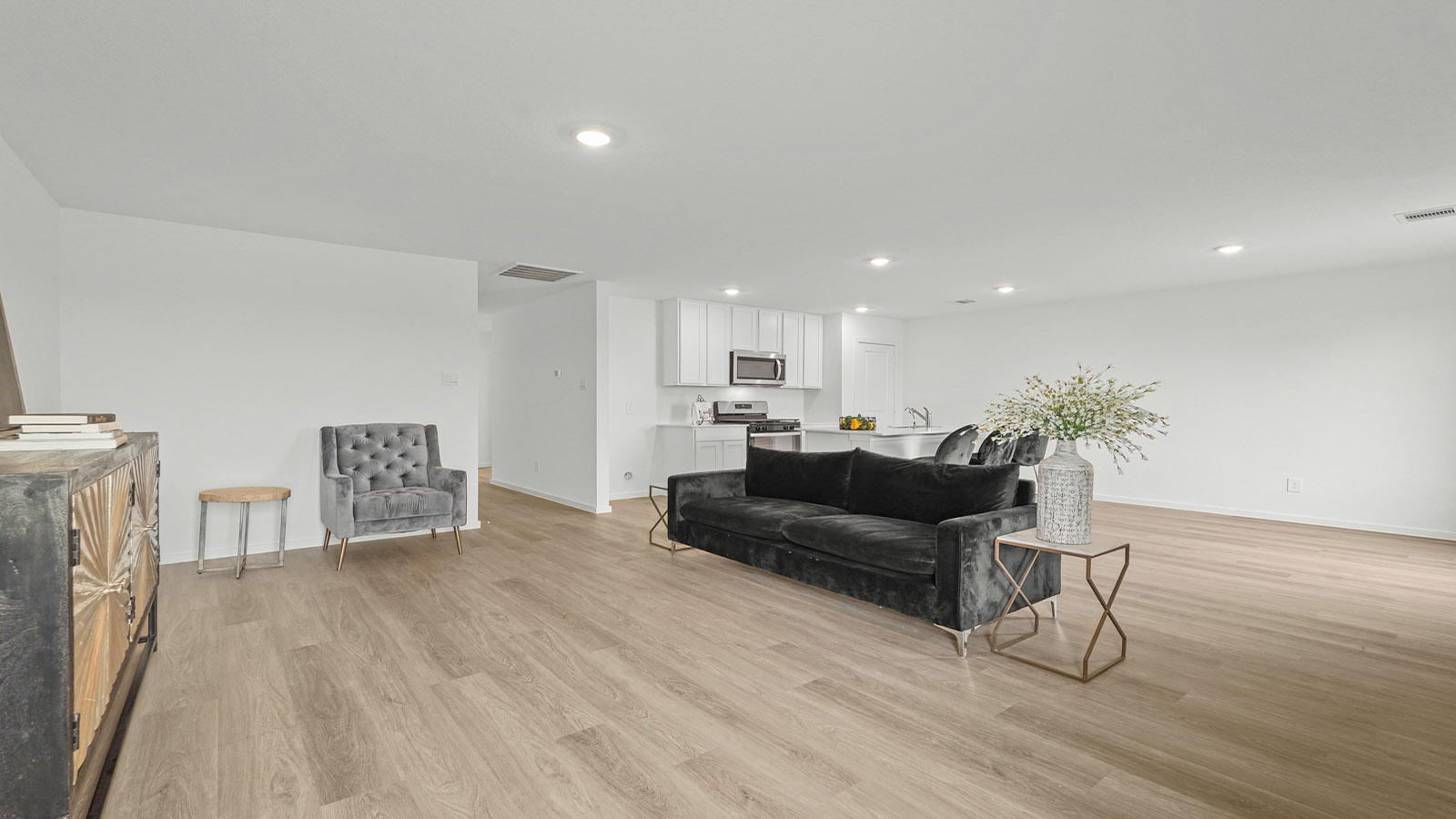 open concept living and dining area with vinyl flooring and large windows