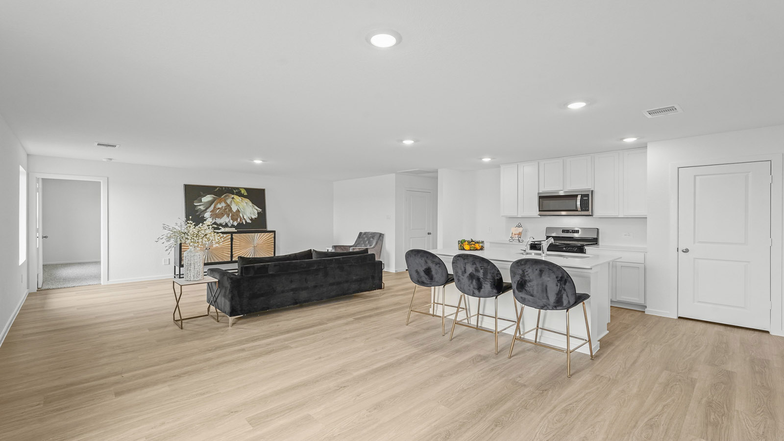 open concept living and dining area with vinyl flooring and large windows