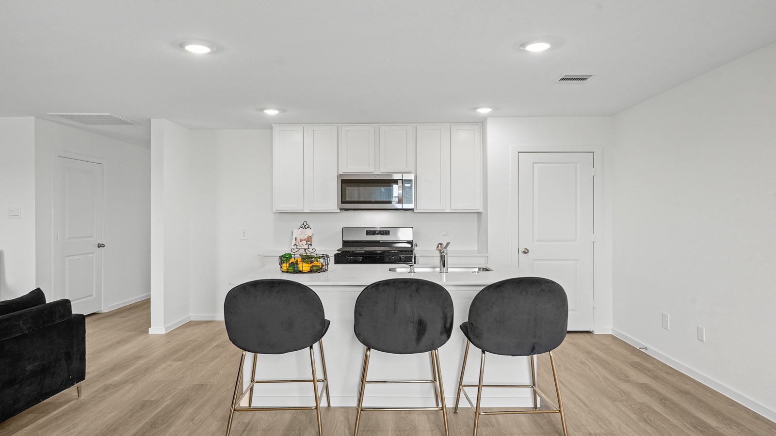 open concept living and dining area with vinyl flooring and large windows