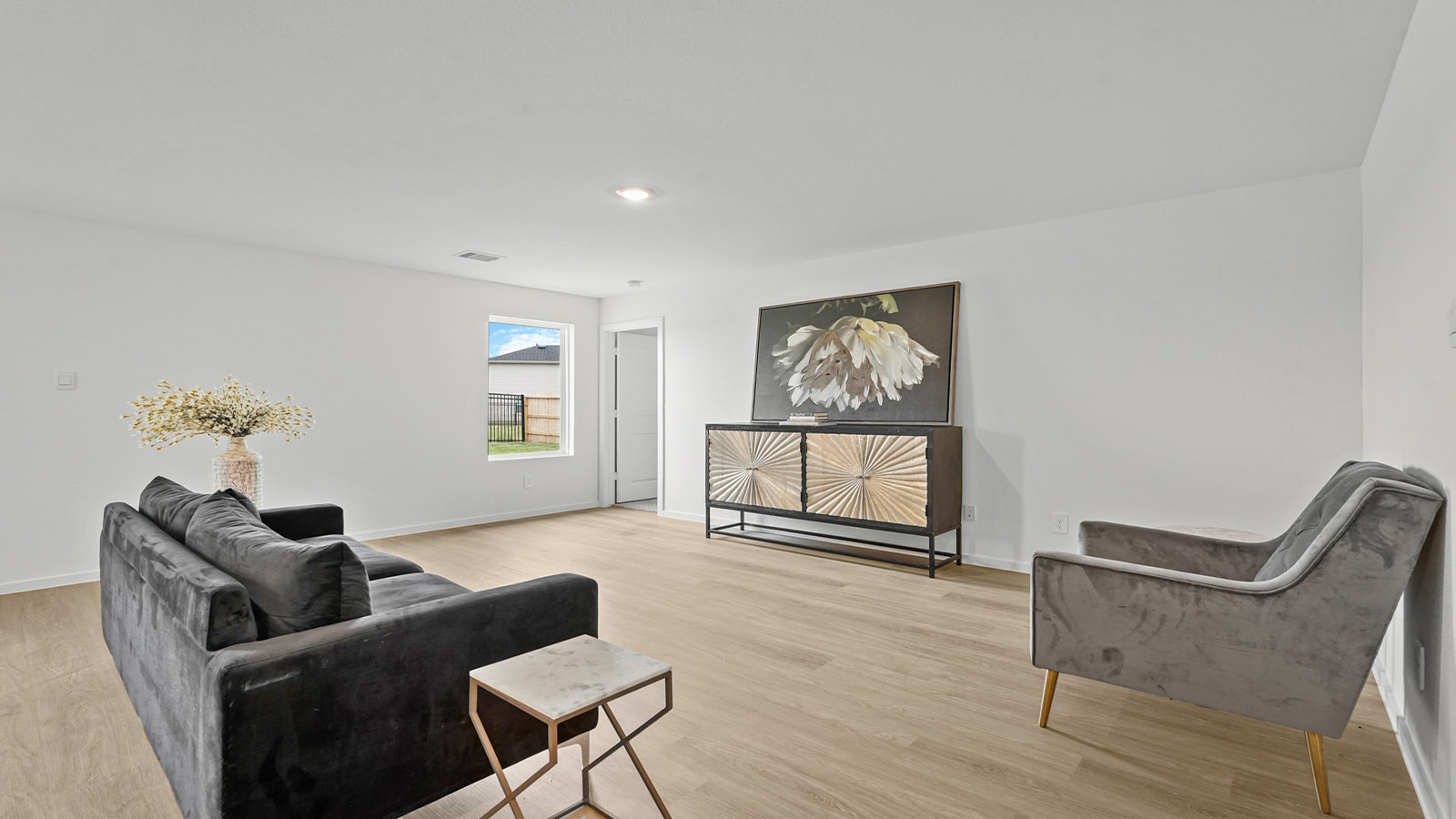 open concept living and dining area with vinyl flooring and large windows