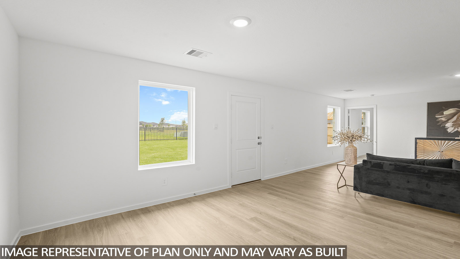 open concept living and dining area with vinyl flooring and large windows