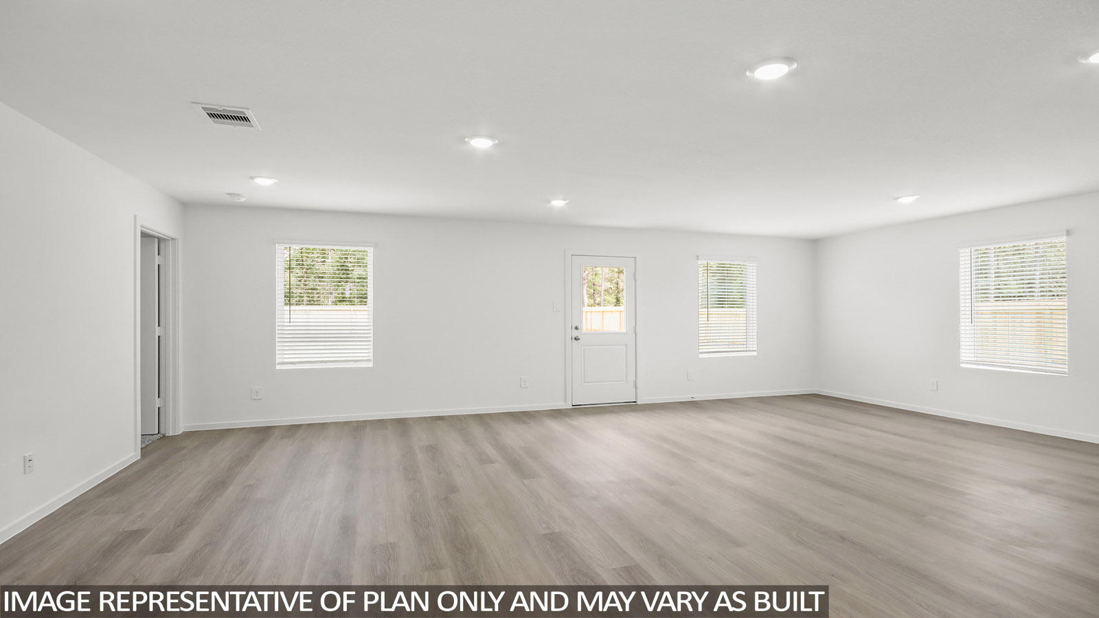 open concept living and dining area with vinyl flooring, quartz countertops. and stainless steel appliances