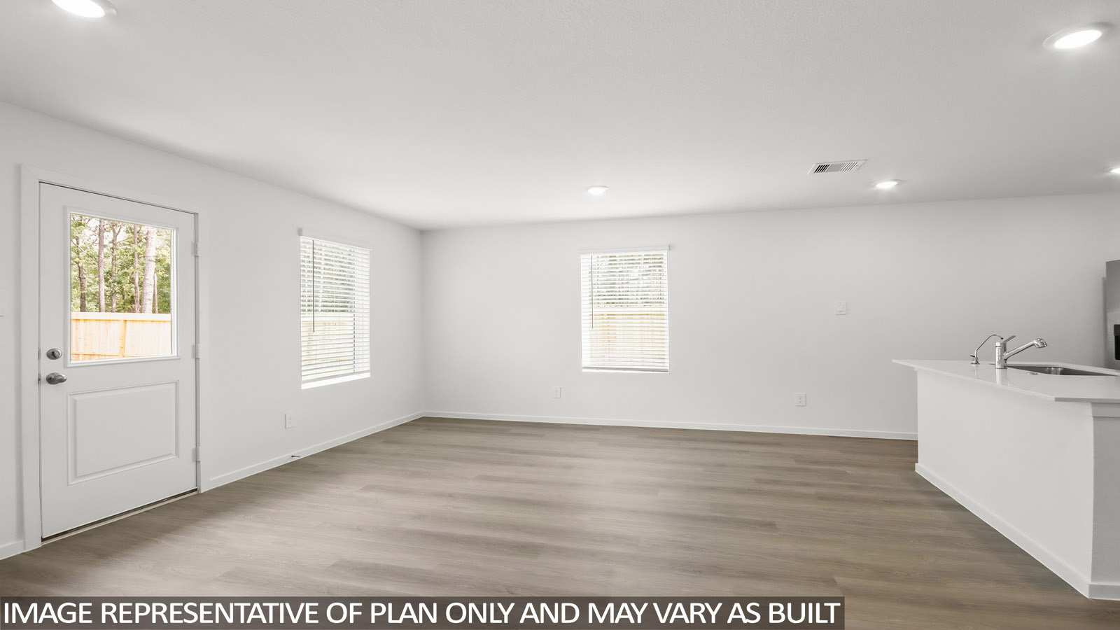 open concept living and dining area with vinyl flooring, quartz countertops. and stainless steel appliances