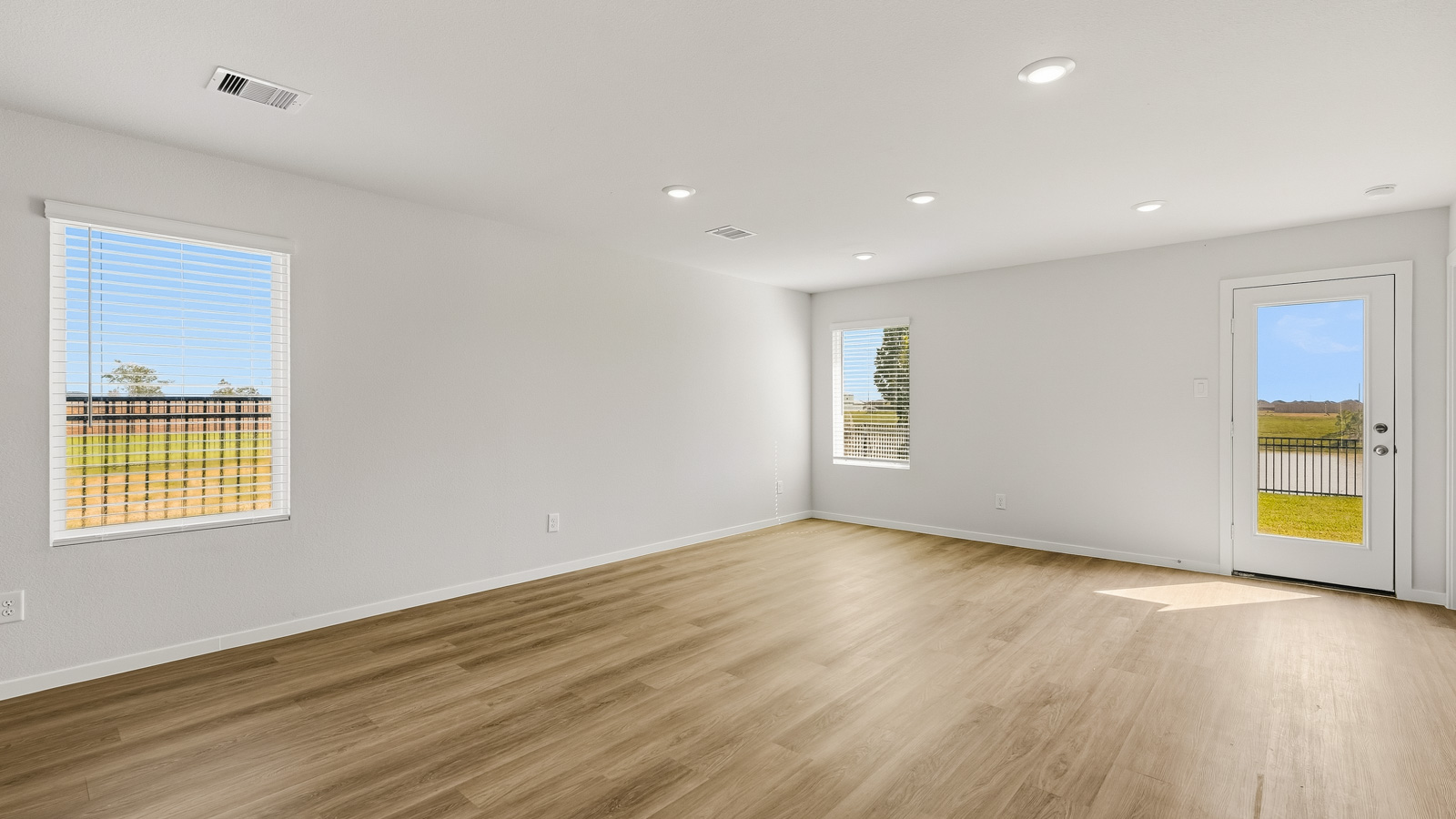 open concept living and dining area with vinyl flooring