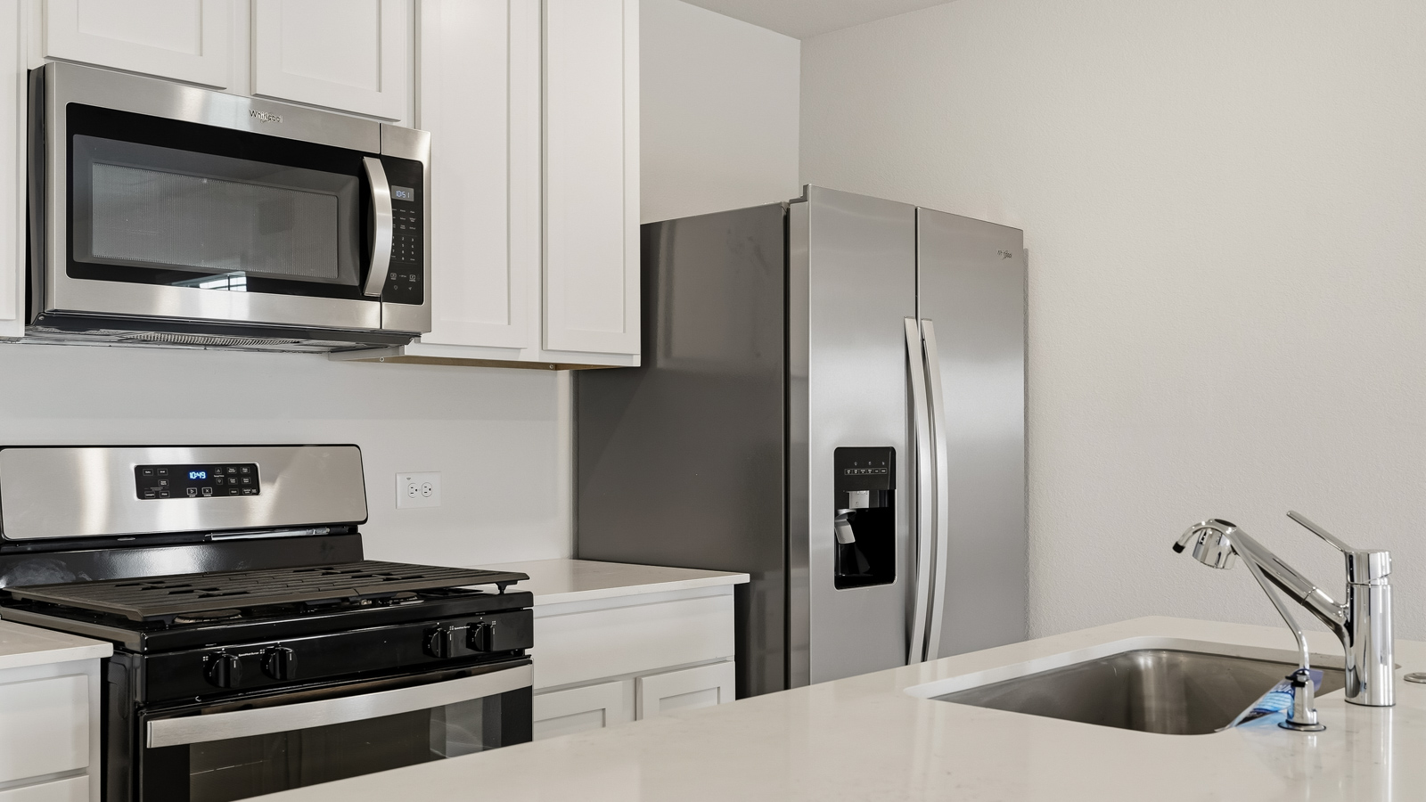kitchen with quartz countertops and stainless steel appliances