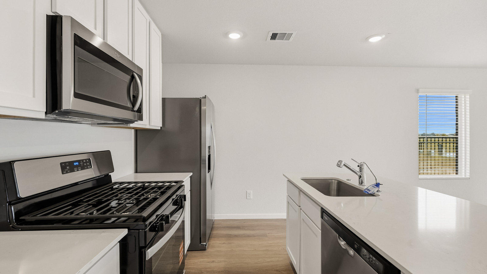 kitchen with quartz countertops and stainless steel appliances