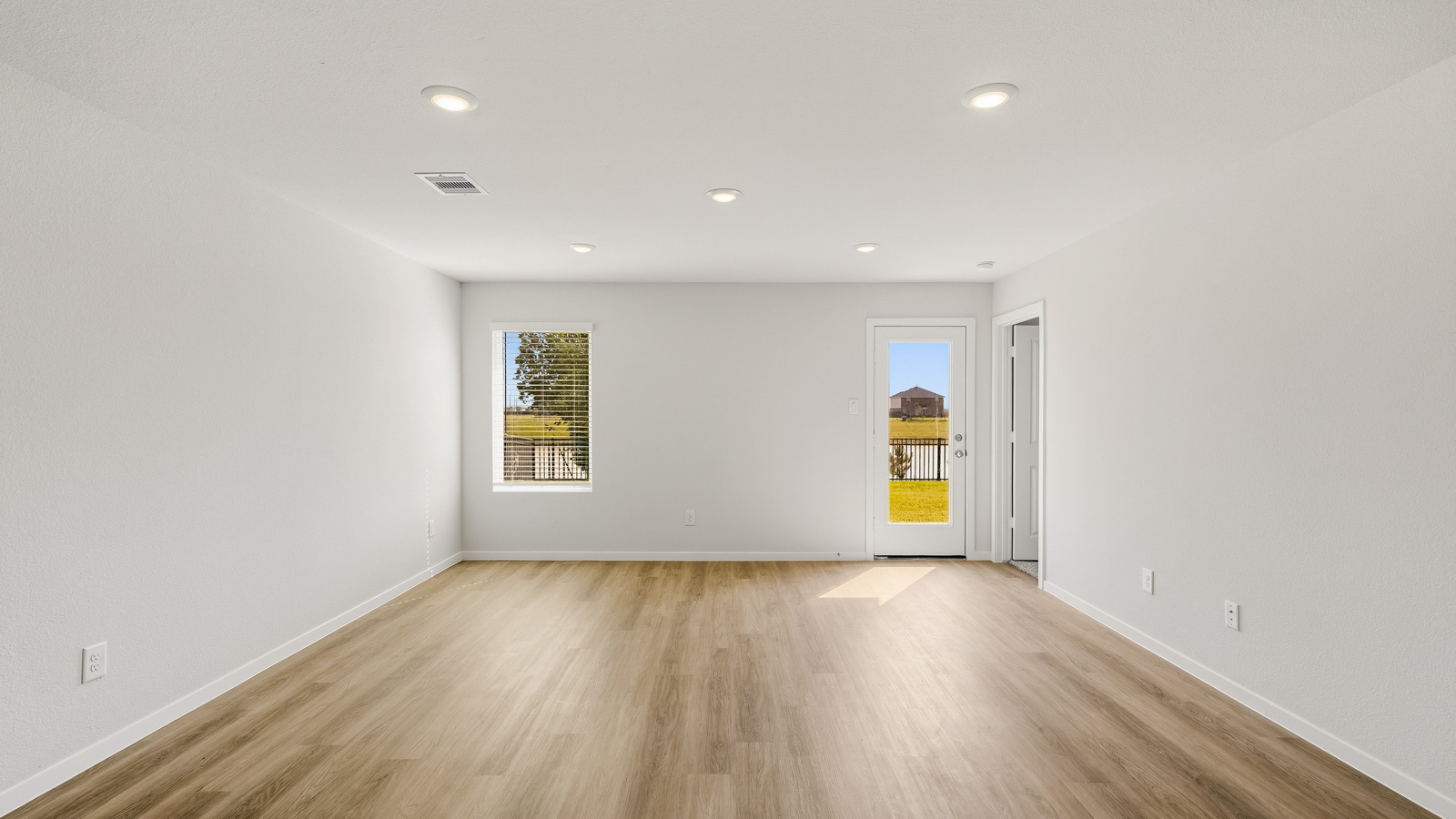 open concept living and dining area with vinyl flooring