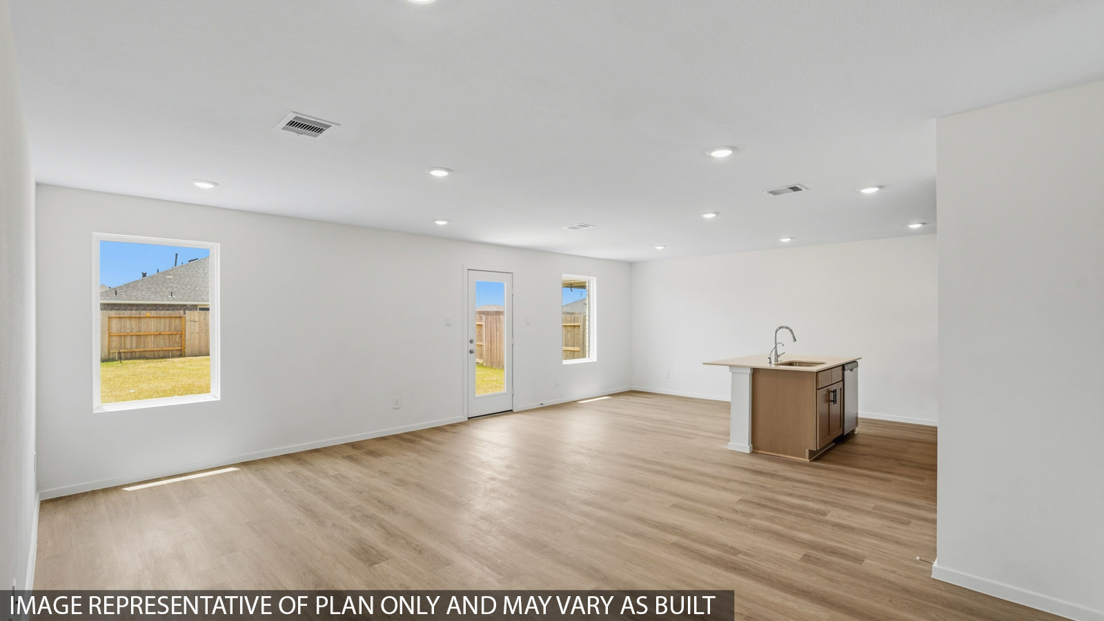open concept living and dining area with vinyl flooring and large windows