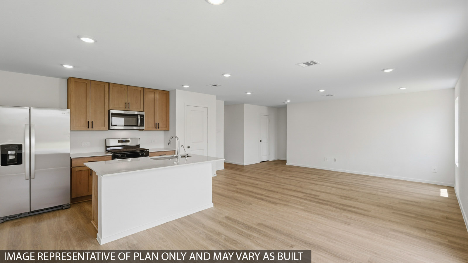 kitchen with quartz countertops, stainless steel appliances