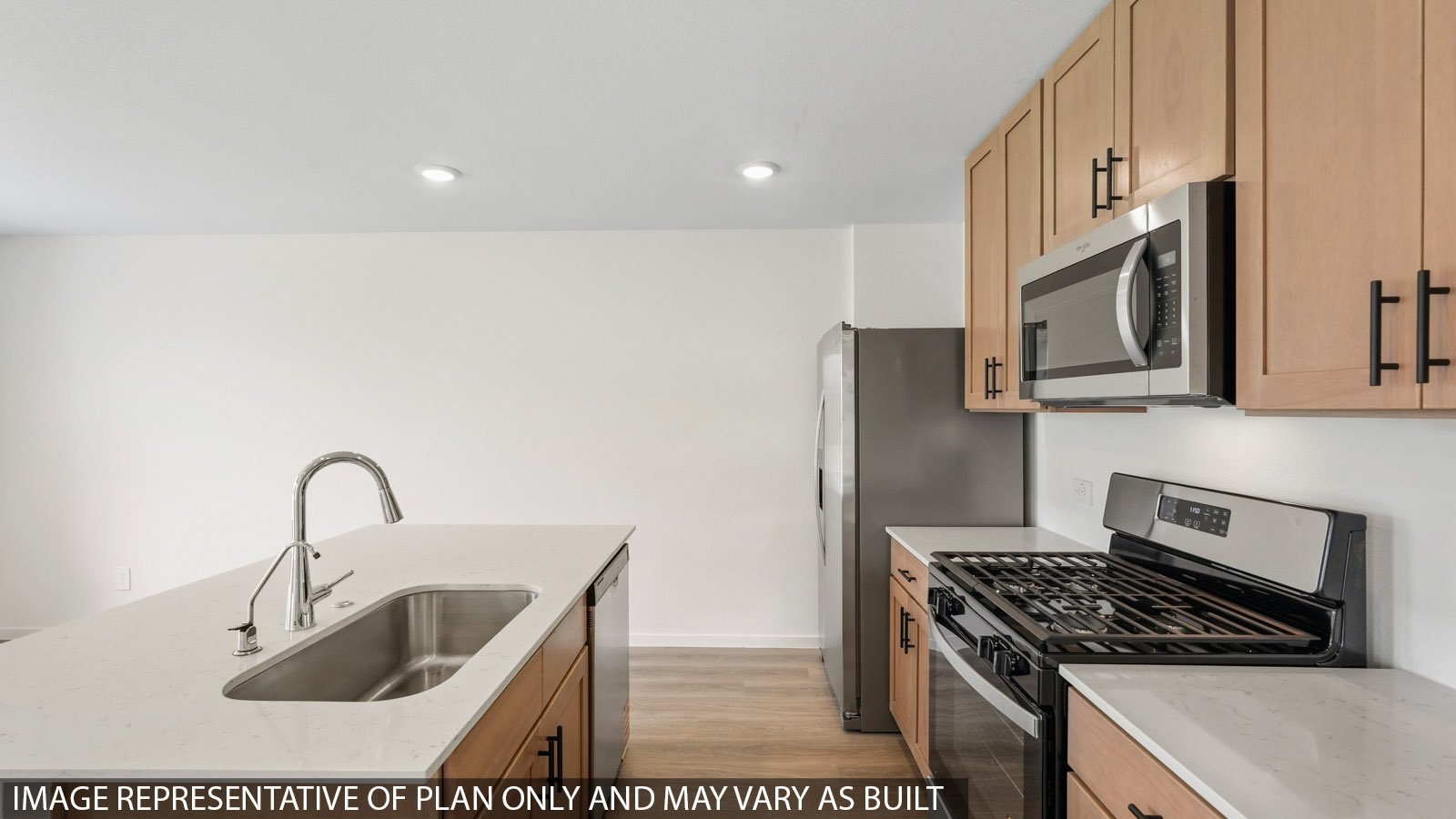 kitchen with quartz countertops, stainless steel appliances