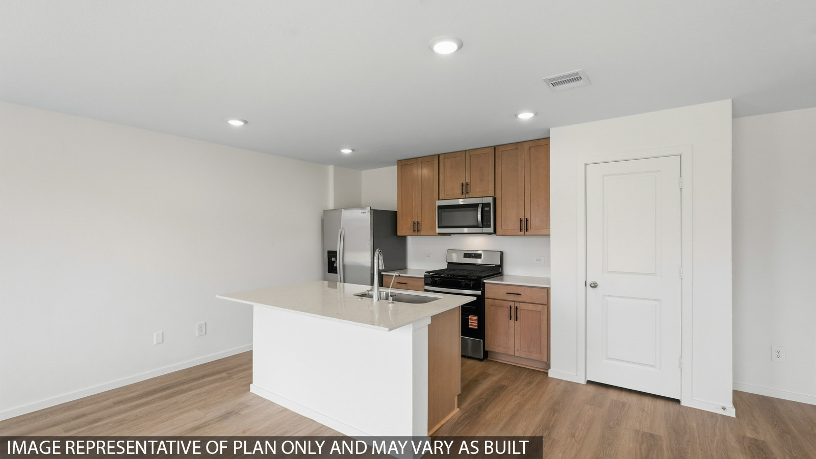 kitchen with quartz countertops, stainless steel appliances