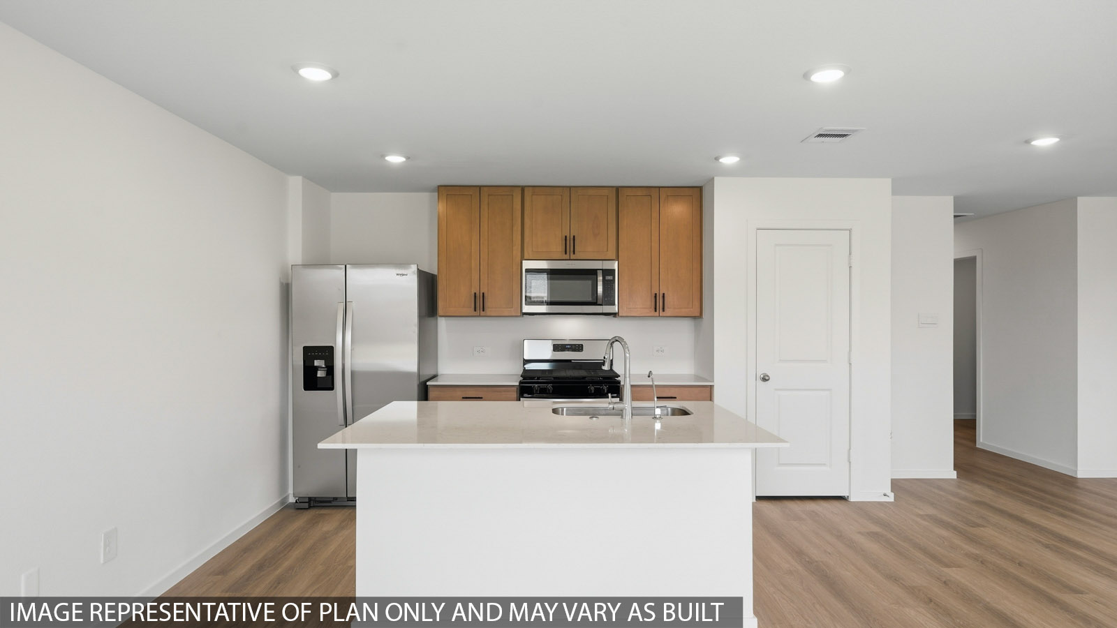 kitchen with quartz countertops, stainless steel appliances