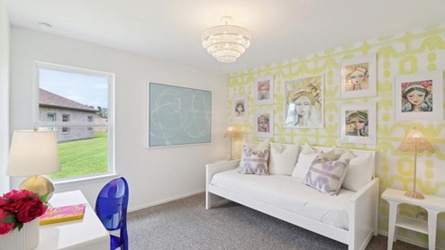 secondary bedroom with carpet flooring and large windows