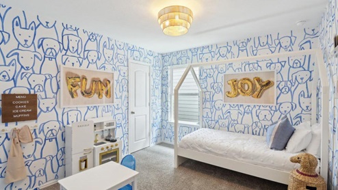 secondary bedroom with carpet flooring and large windows