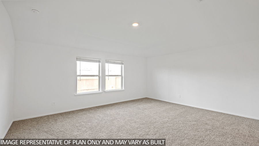 Primary bedroom with carpet flooring
