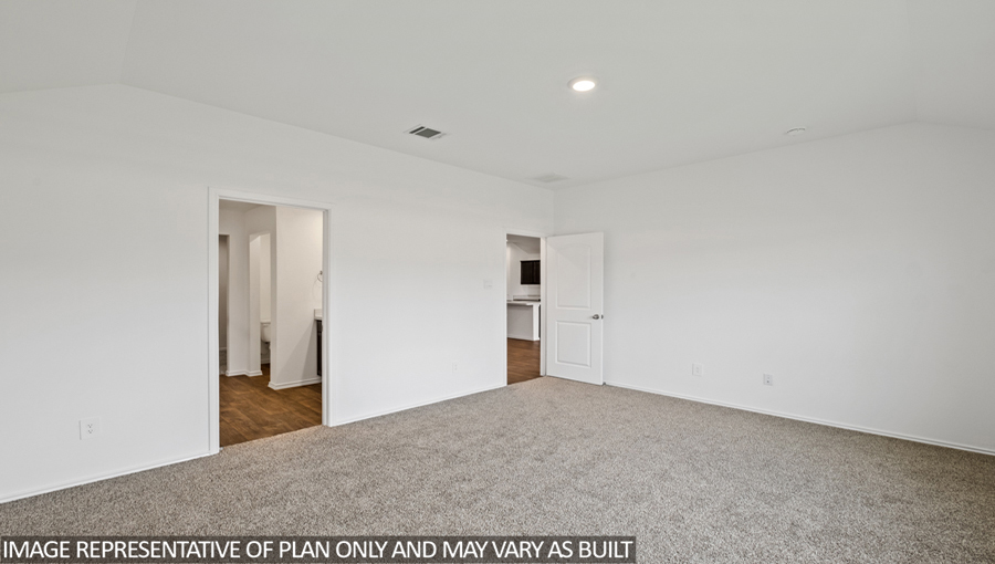 Primary bedroom with carpet flooring