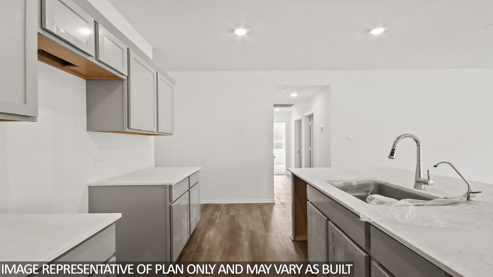 open concept living and dining area with vinyl flooring, stainless steel appliances, and quartz countertops