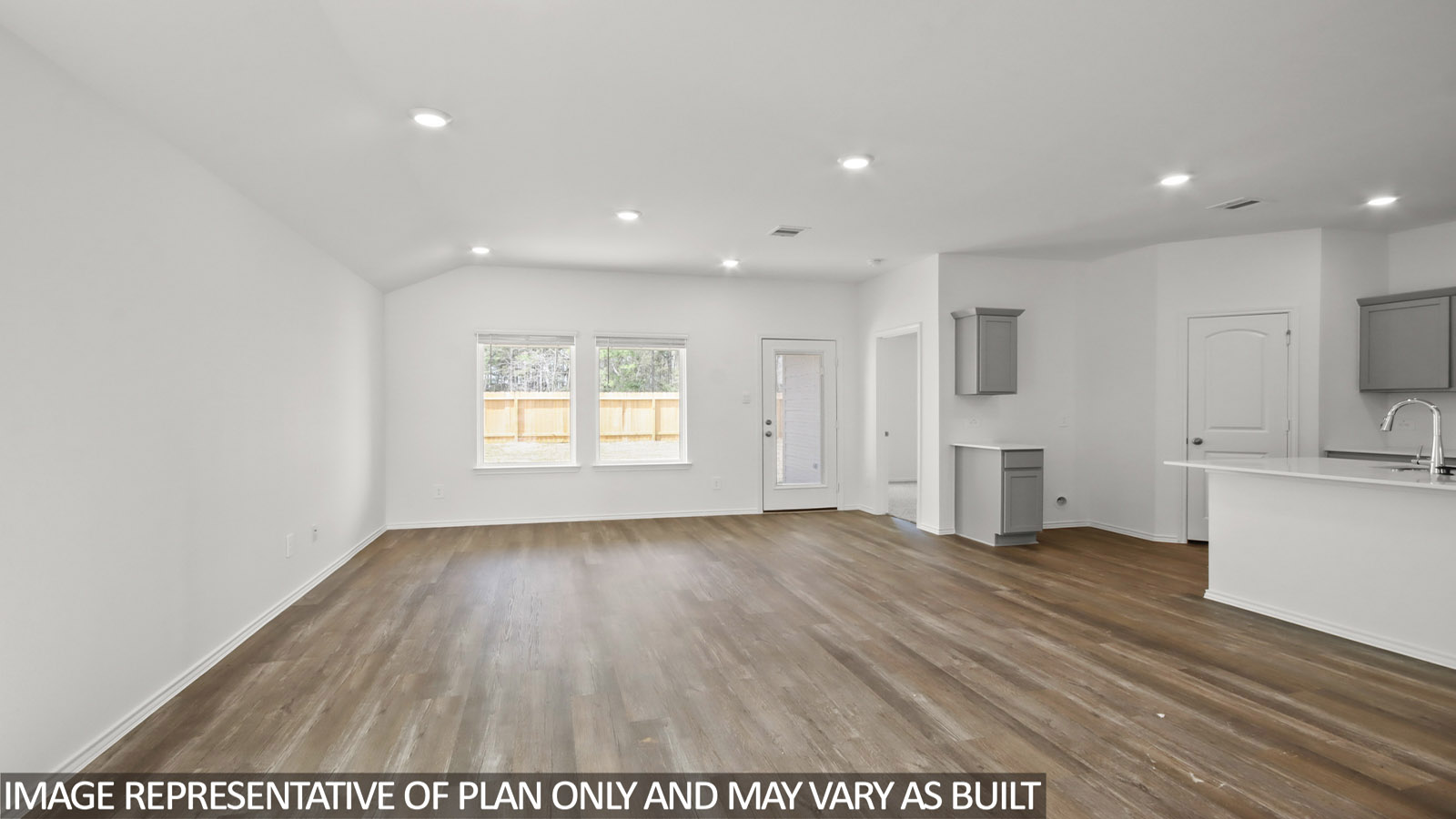 open concept livingand dining area with vinyl flooring and large windows