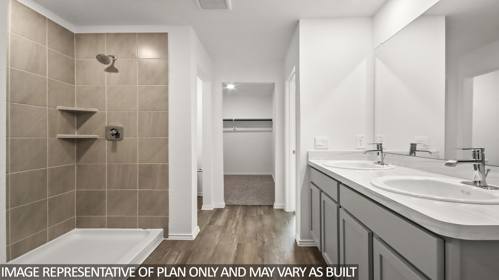 primary bathroom with dual vanity sinks