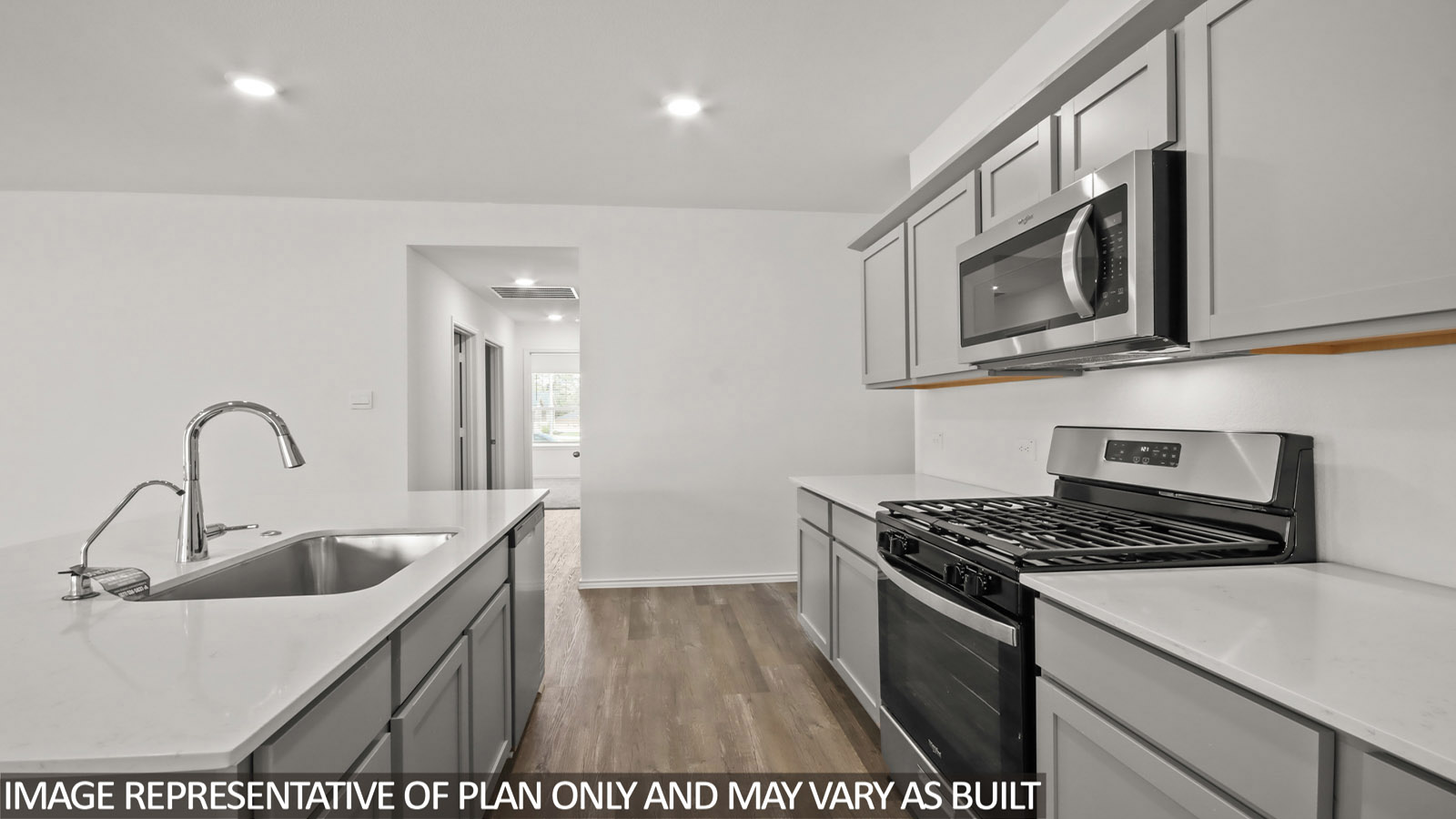 open concept living and dining area with vinyl flooring, large windows, and quartz countertops