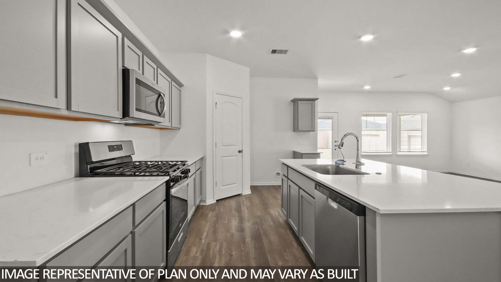 open concept living and dining area with vinyl flooring, large windows, and quartz countertops