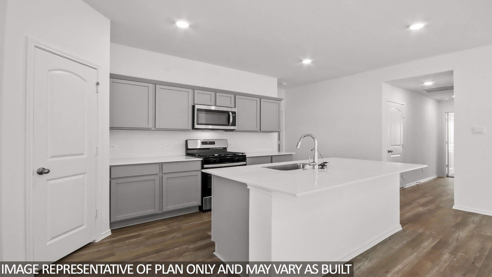 Kitchen with an island and vinyl floor