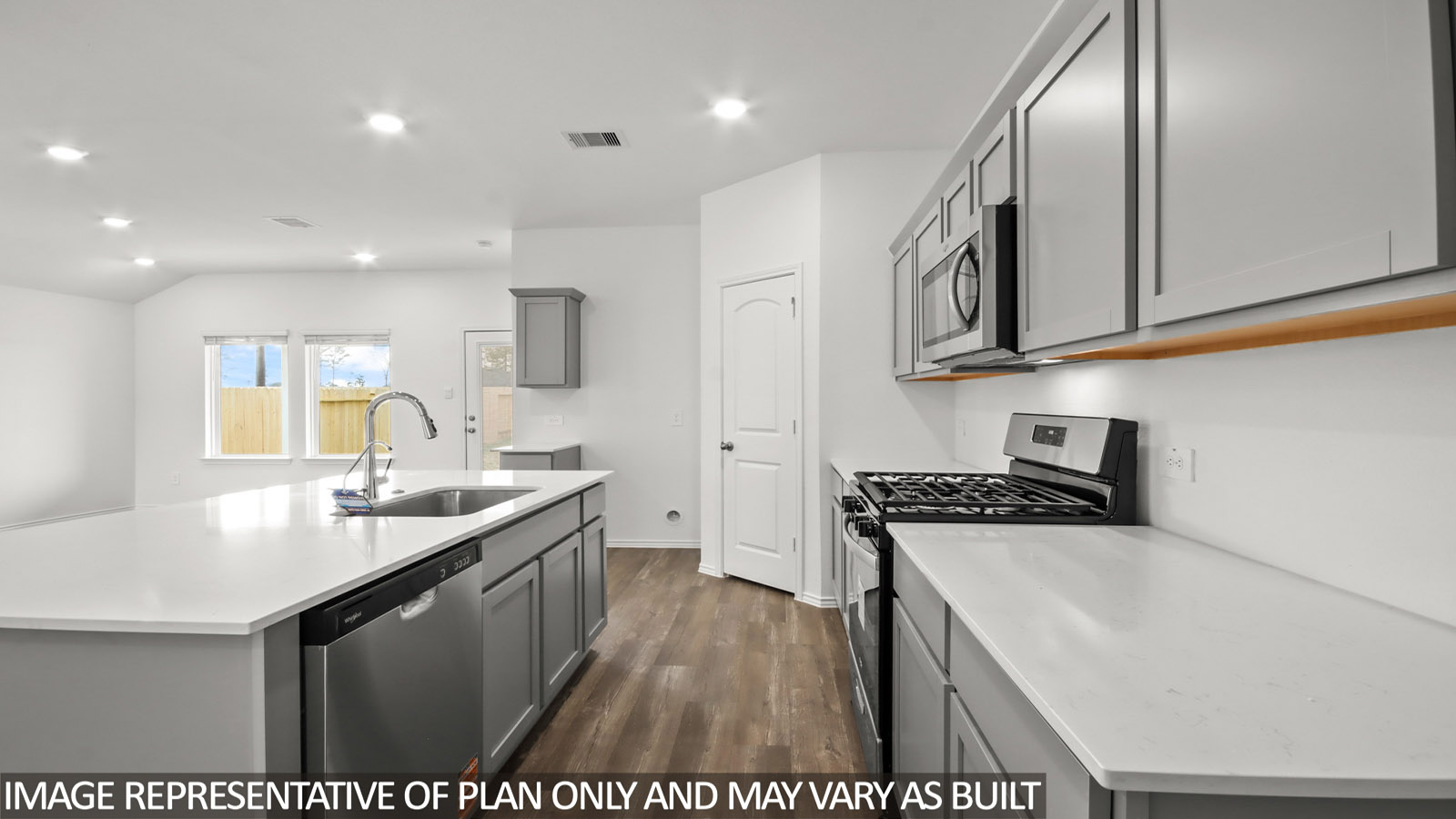 Kitchen with an island and vinyl floor