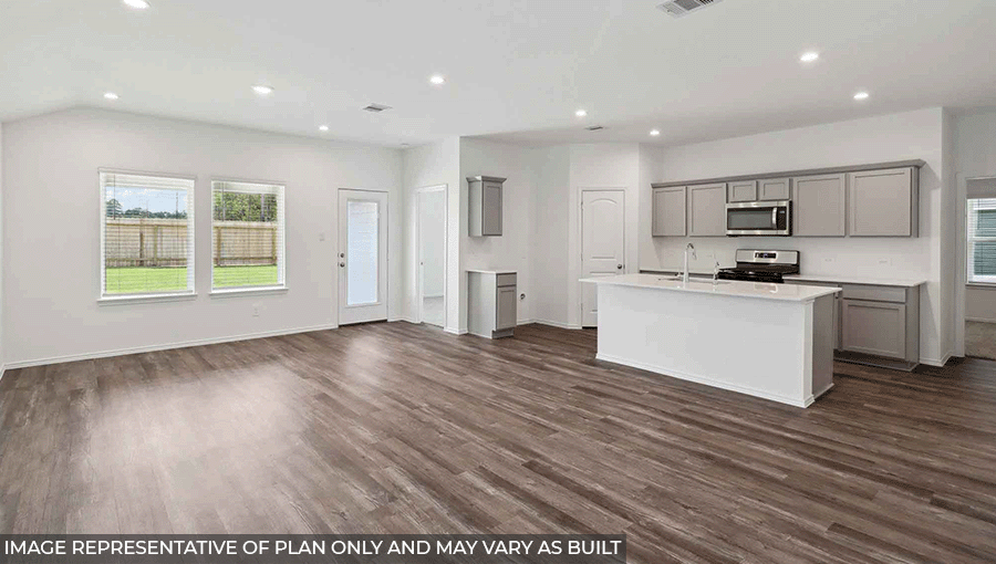 open concept living and dining area with vinyl flooring, large windows and quartz countertops in Magnolia, TX