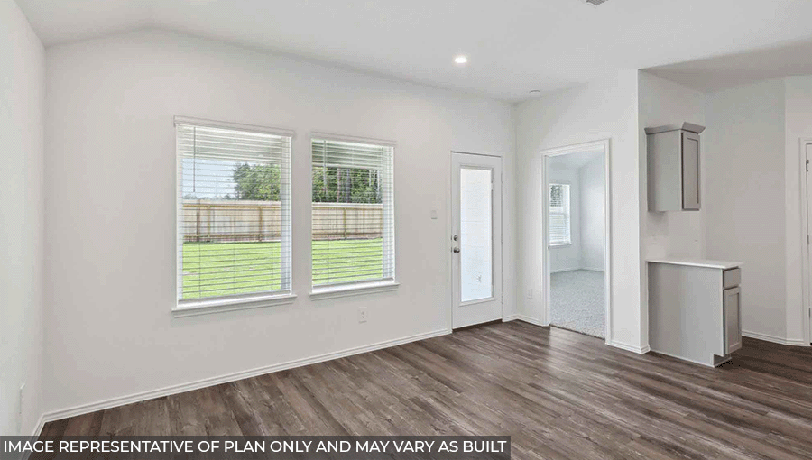 open concept living and dining area with vinyl flooring, large windows and quartz countertops in Magnolia, TX