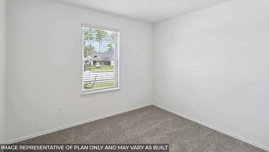 bedroom with carpet flooring and windows in Magnolia, TX