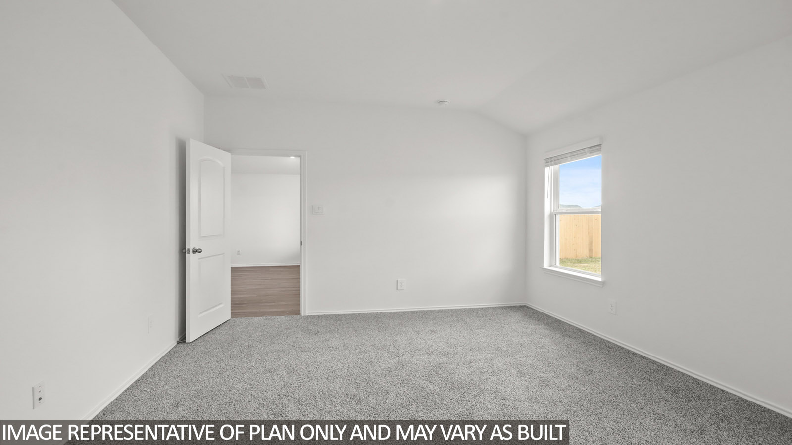 .bedroom with carpet flooring and window in Magnolia, TX