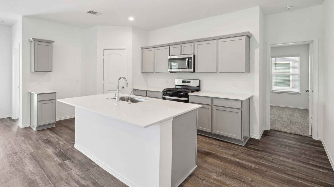 open concept living and dining area with vinyl flooring, large windows, and quartz countertops