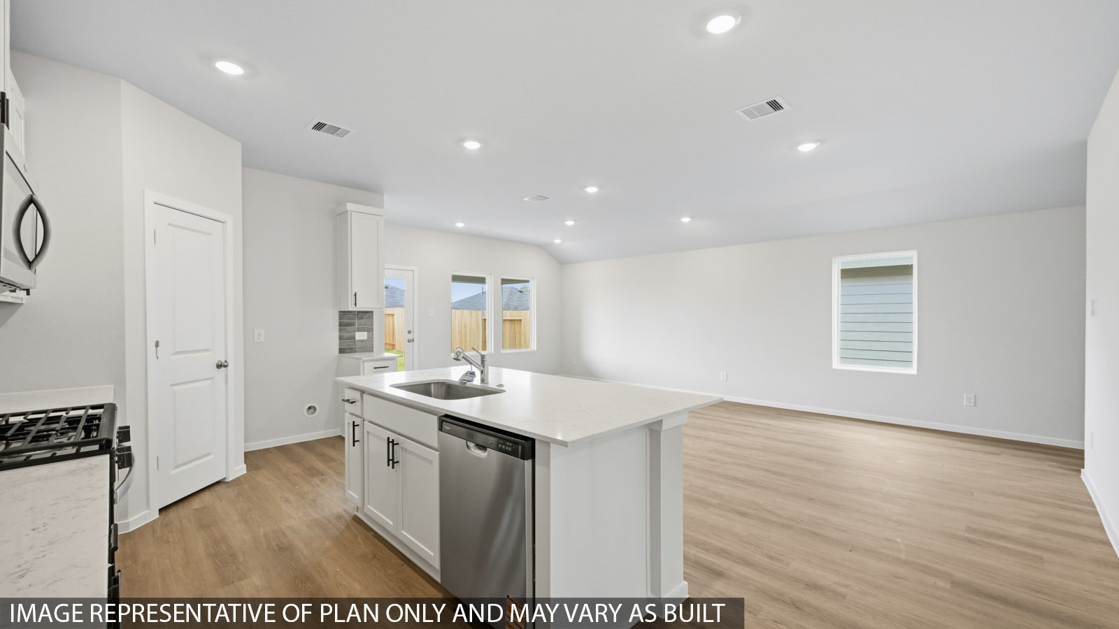open concept living and dining area with vinyl flooring and large windows