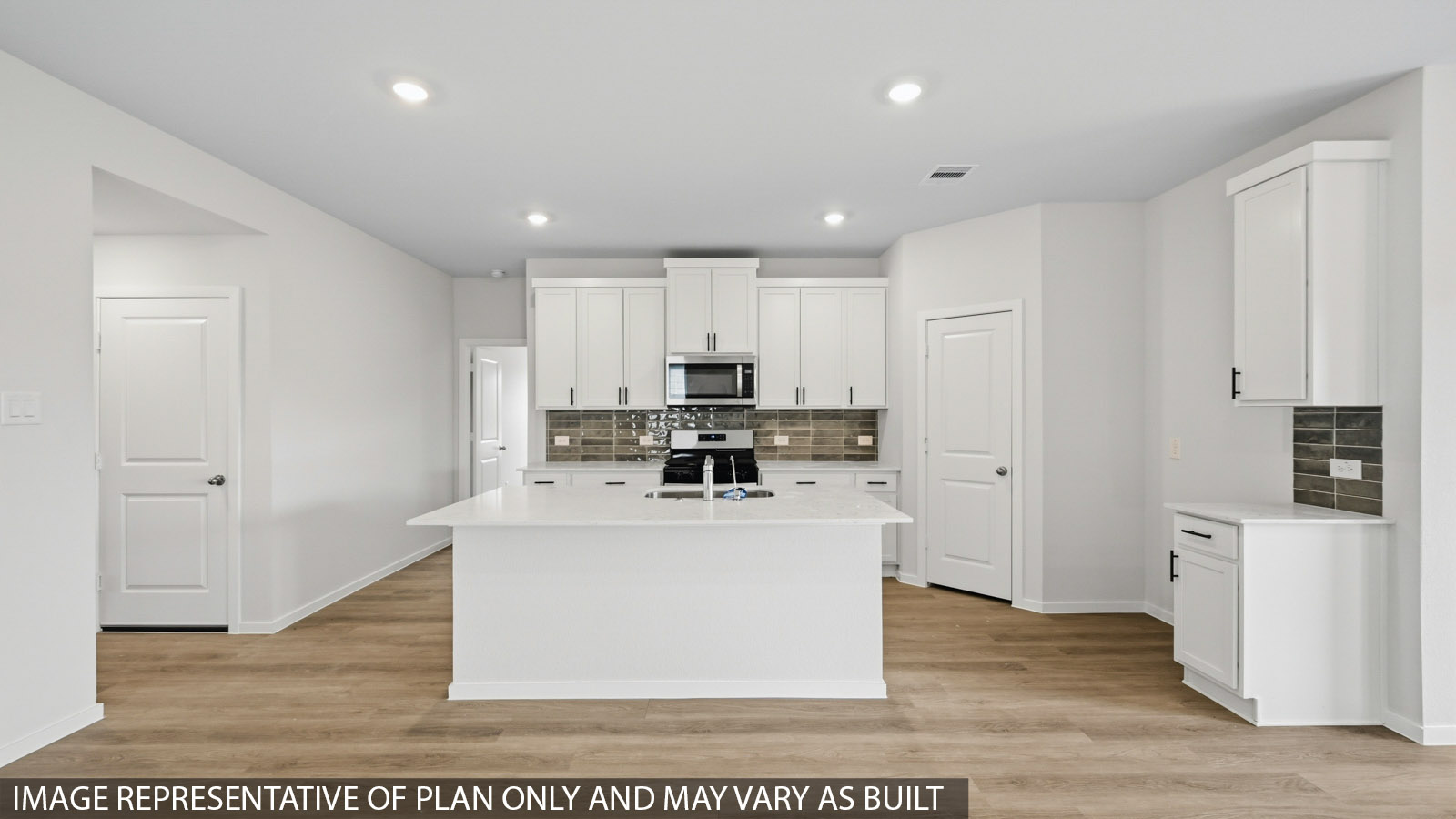 open concept living and dining area with vinyl flooring and large windows