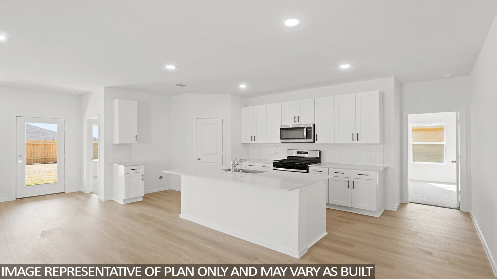 open concept living and dining area with vinyl flooring , quartz countertops, and large windows