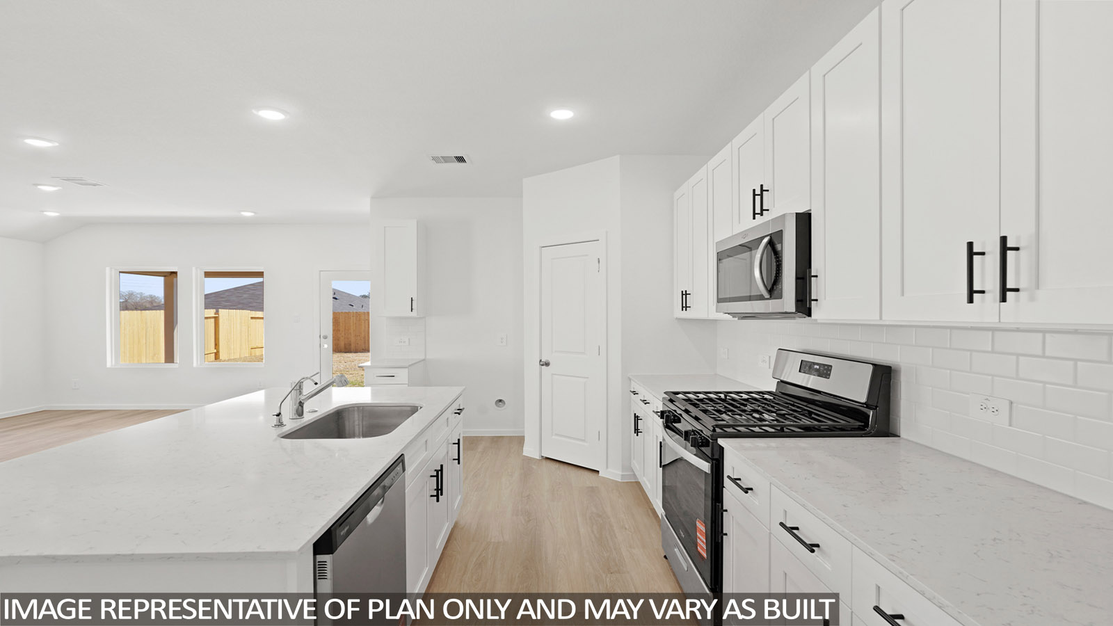 open concept living and dining area with vinyl flooring , quartz countertops, and large windows