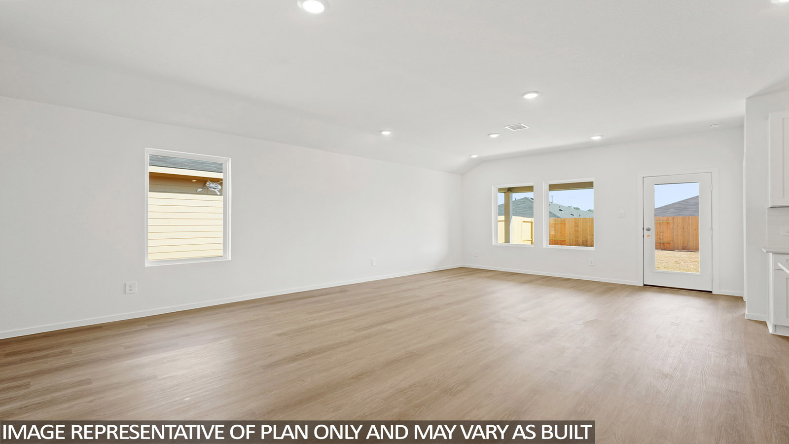 open concept living and dining area with vinyl flooring , quartz countertops, and large windows