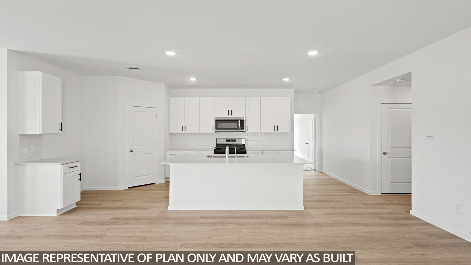 open concept living and dining area with vinyl flooring , quartz countertops, and large windows
