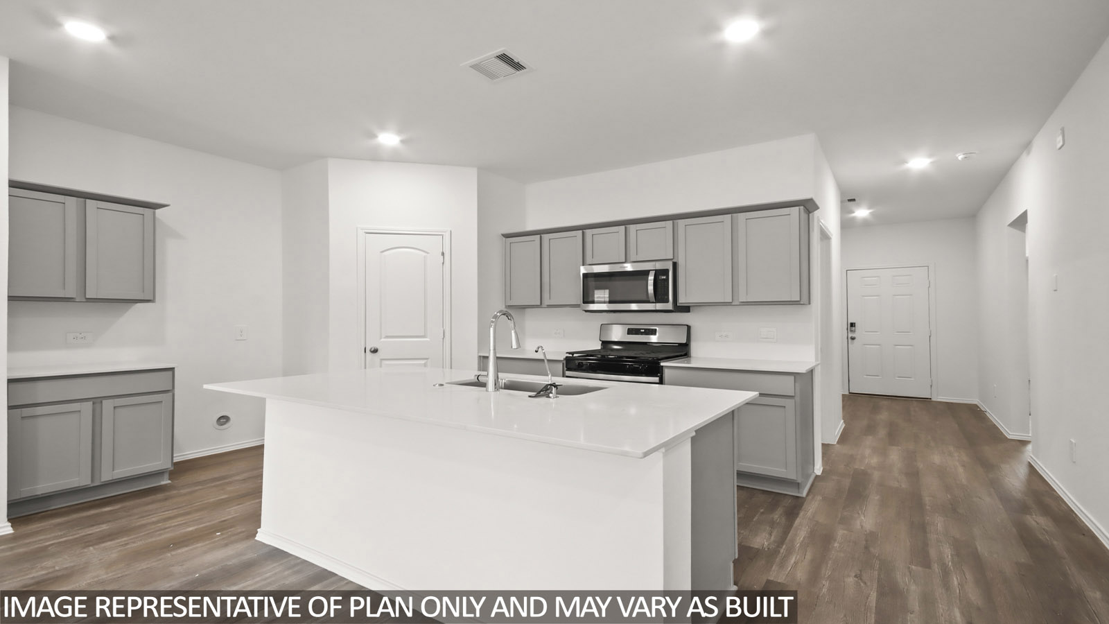 open concept livivng and dining area with vinyl flooring, quartz countertops nad large windows