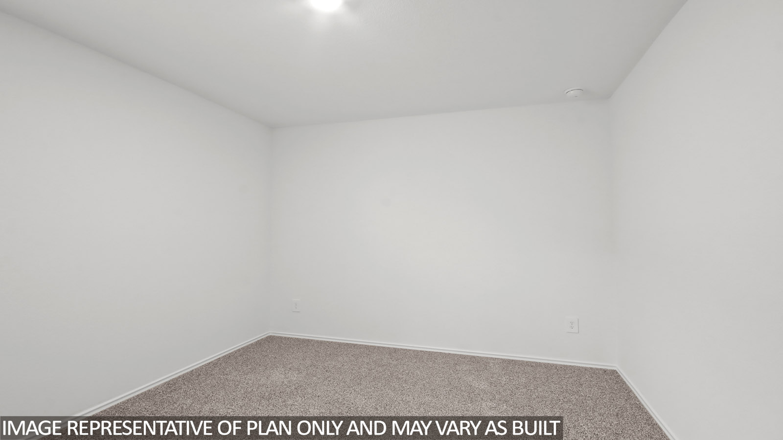 Secondary bedroom with carpet flooring