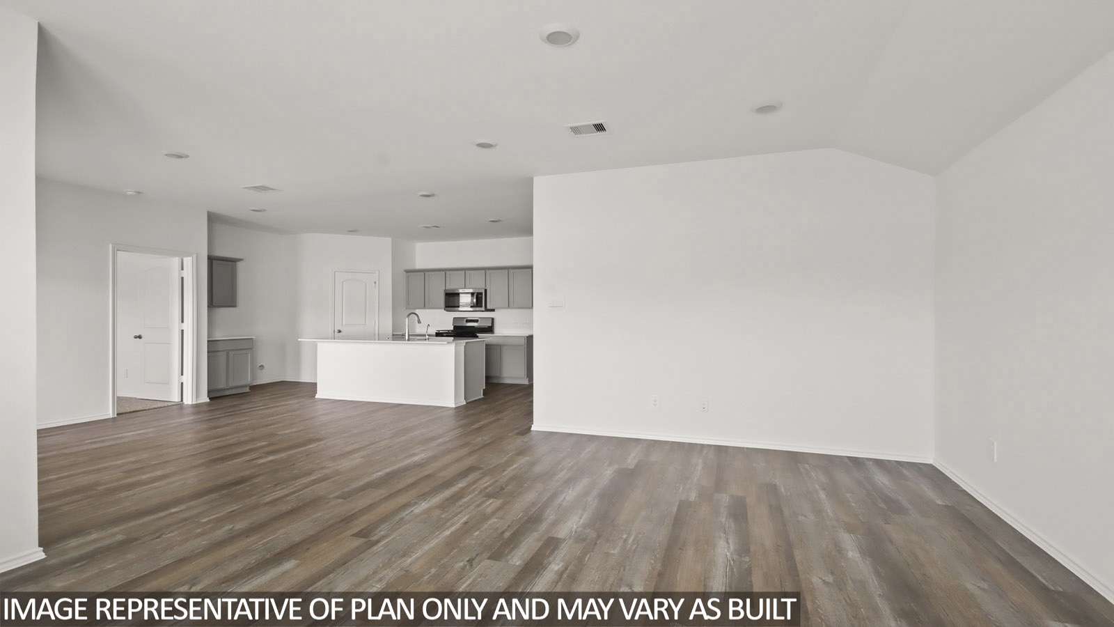 open concept living and dining area with vinyl flooring and large windows in Magnolia, TX