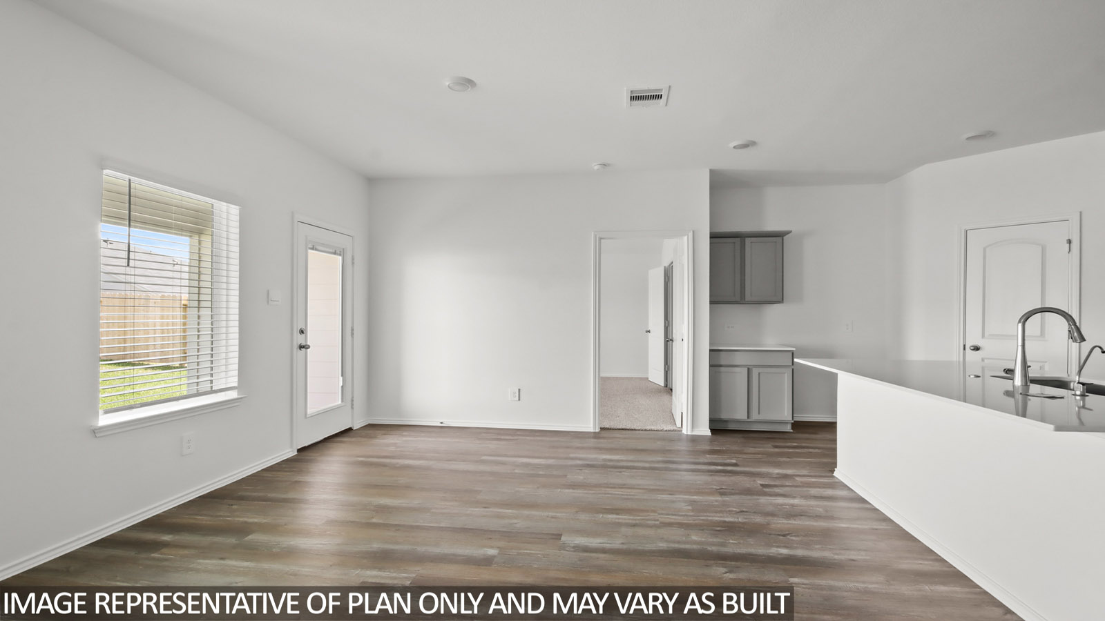 open concept living and dining area with vinyl flooring and large windows in Magnolia, TX