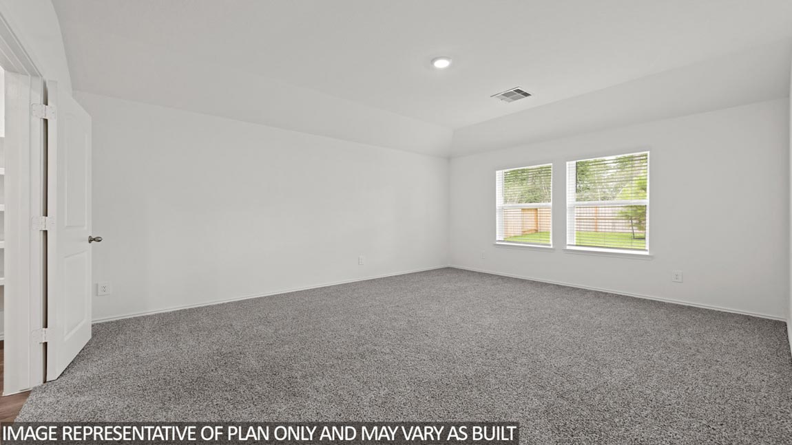 open concept living with vinyl flooring, quartz countertops, and large windows