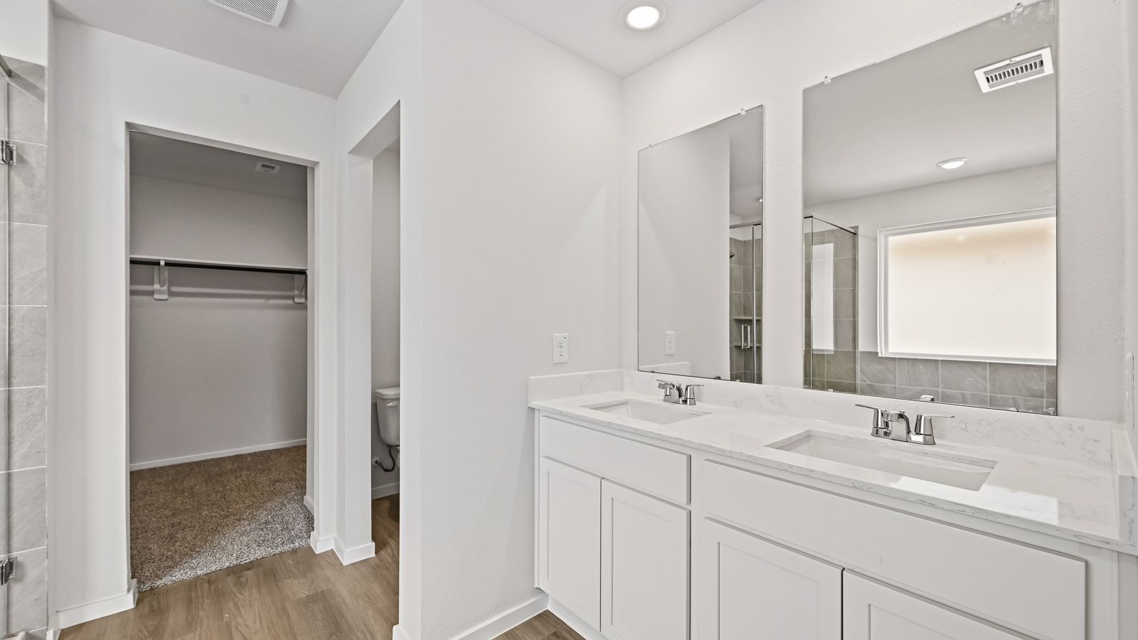 Primary bathroom with soaker tub and tile shower with semi frameless glass in Hockley TX