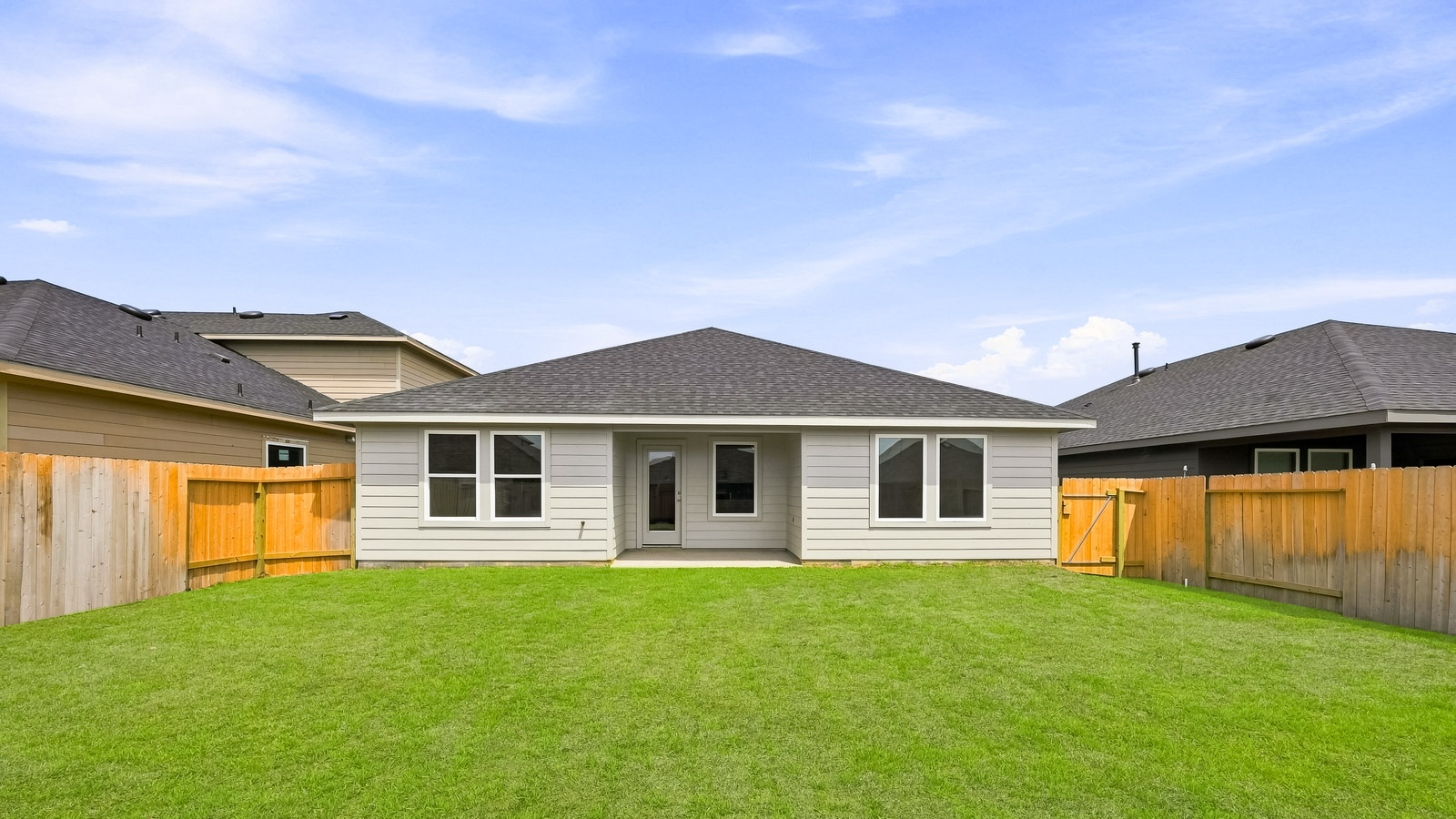 covered patio with jamies hardie siding and overhead lighting