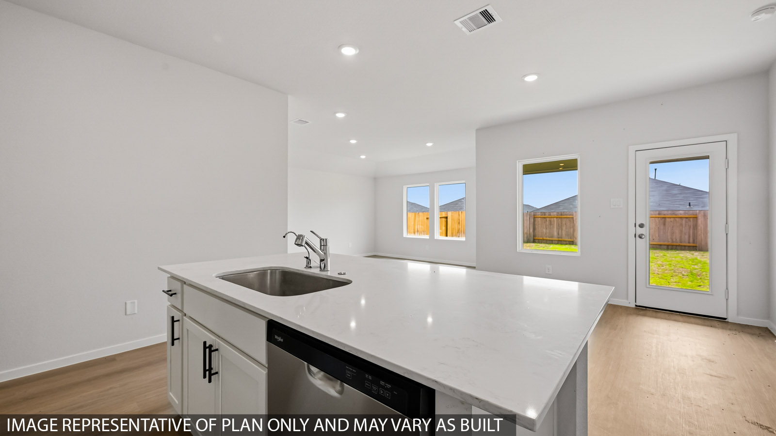 kitchen with quartz countertops, stainless steel appliances, and backsplash