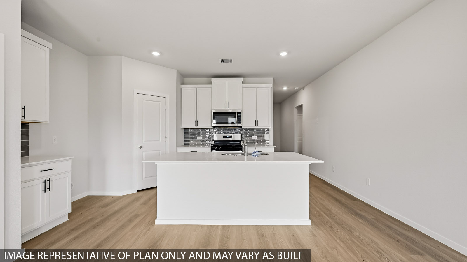 kitchen with quartz countertops, stainless steel appliances, and backsplash