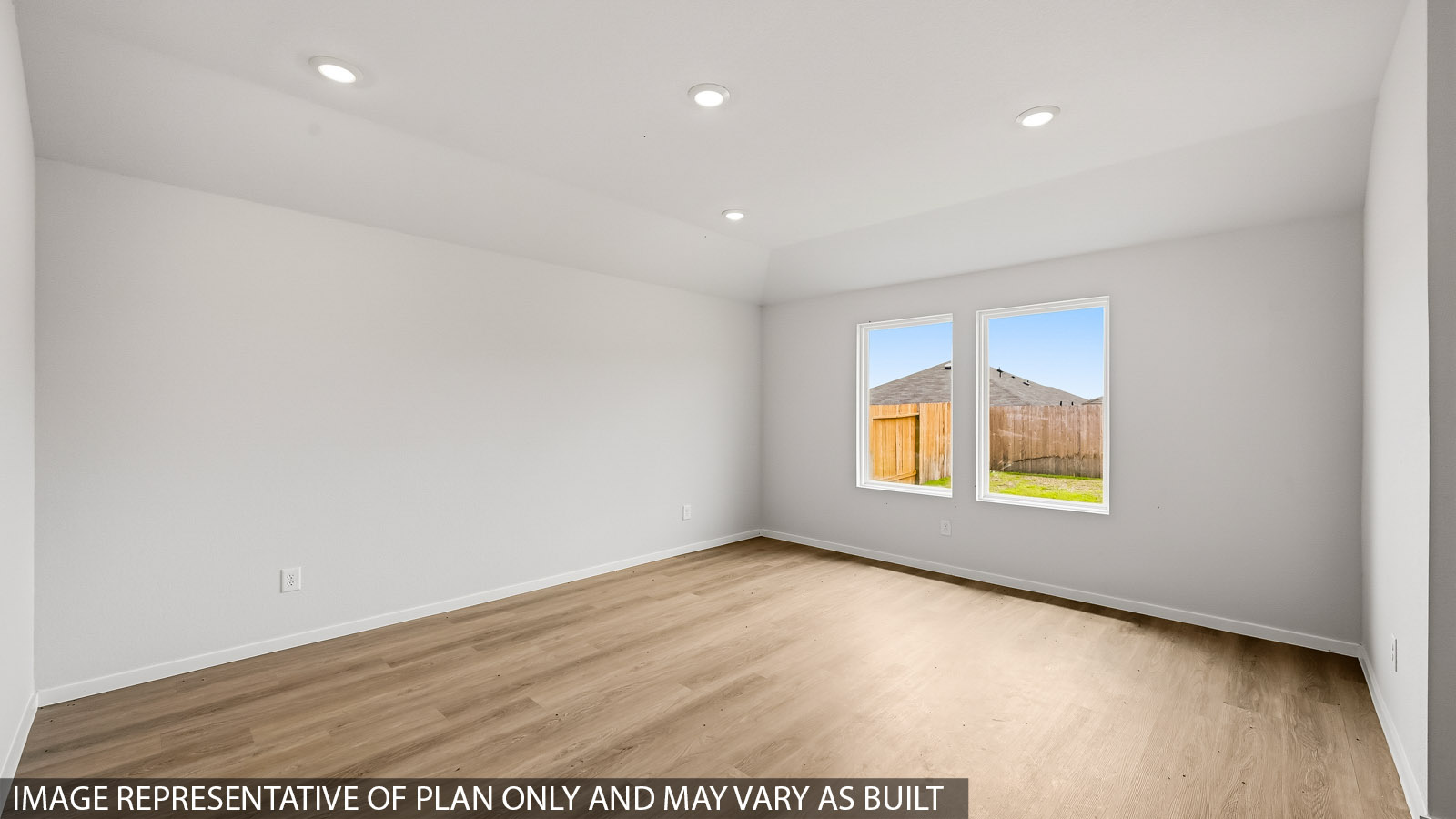 open concept living and dining area with vinyl flooring and large windows