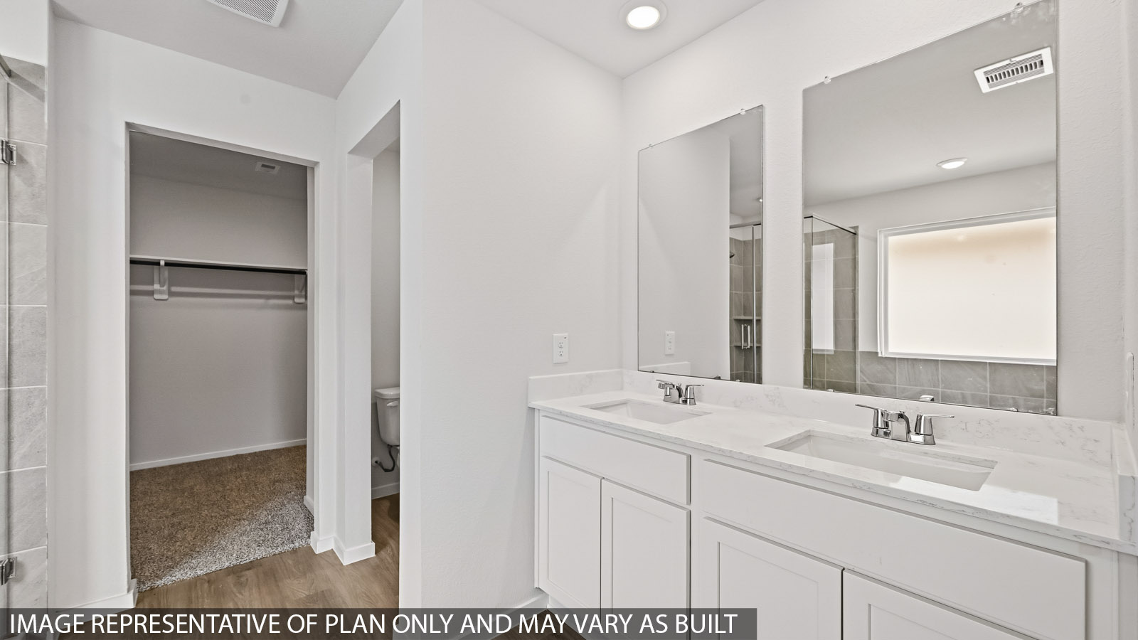 primary bathroom with separate tub and shower